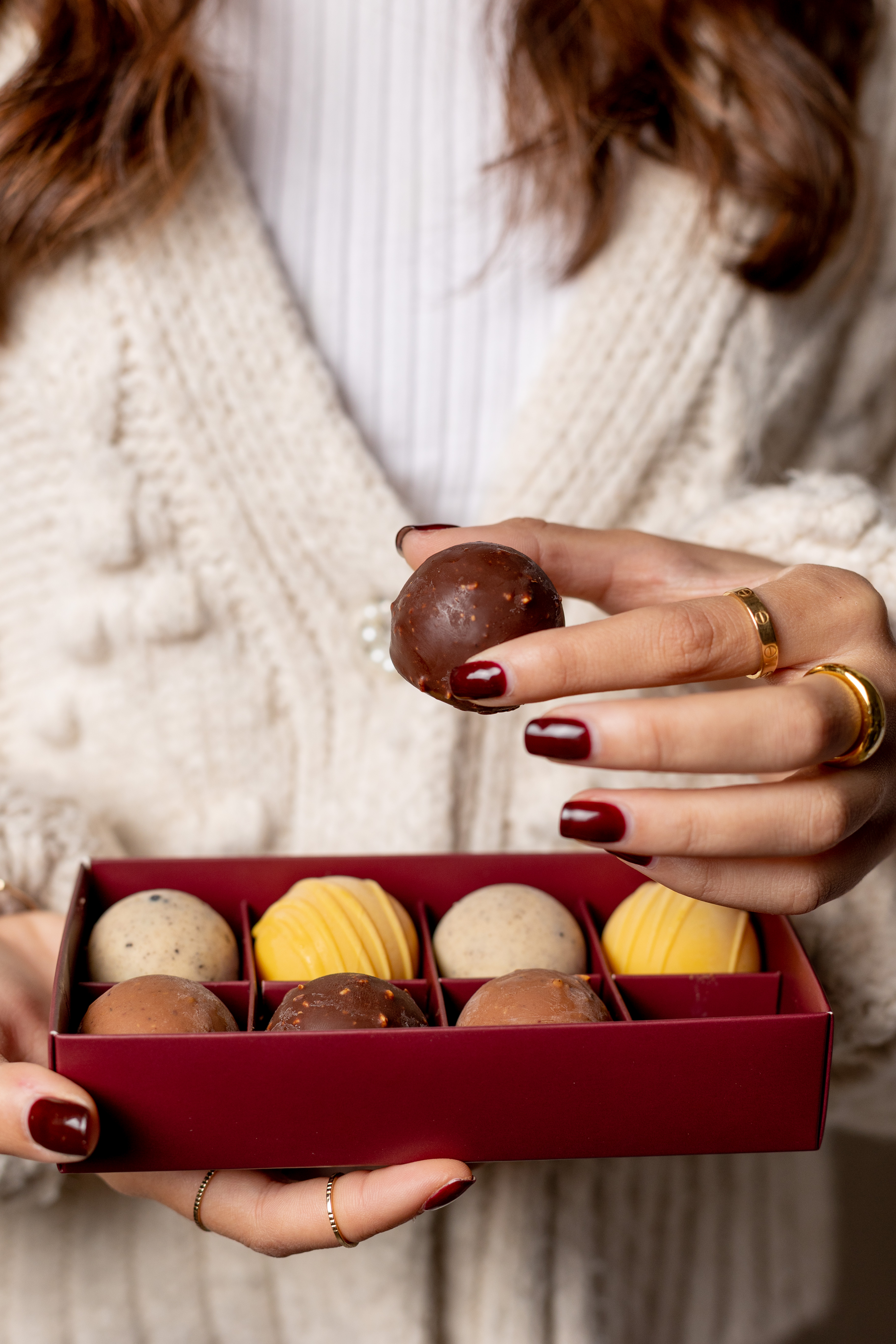 Woman holding box of Haagen-Dazs Delights